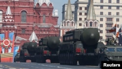 Russian mobile Topol-M missile launching units drive in formation during the Victory Day parade in Moscow's Red Square May 9, 2014. Russia celebrates the 1945 victory over Nazi Germany during World War II every May 9. 