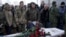 FILE - Fellow Ukrainian government soldiers and mourners bid farewell to Oleksandr Ilnitsky, who was shot dead by a pro-Russian rebel sniper in Ukraine's eastern Donetsk region, during a service in Kyiv's Independence Square, Jan. 11, 2016.