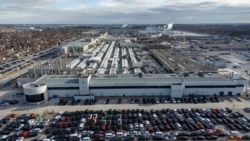 FILE: A drone view of the Stellantis Chrysler Windsor Assembly facility in Windsor, Ontario, Canada, Feb. 4, 2025. On Wednesday, U.S. President Donald Trump delayed for a month imposing a new 25% tariff on vehicle imports from Mexico and Canada.