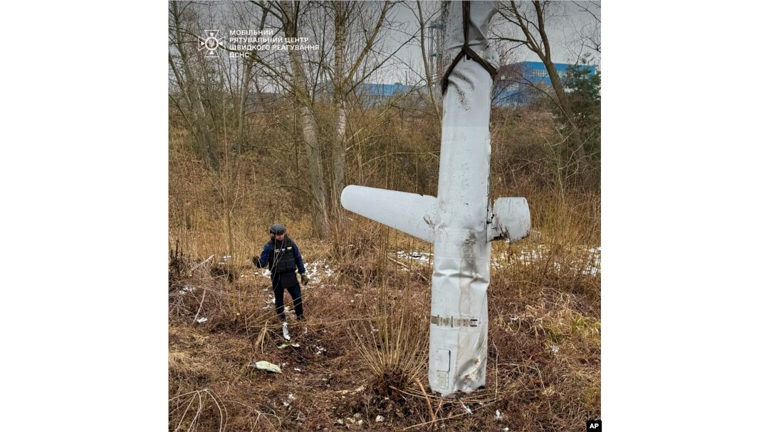 In this photo provided by the Ukrainian Emergency Service, pyrotechnists examine an X-55 Russian cruise missile that was shot down in Kyiv, Ukraine, on Nov. 28, 2024.