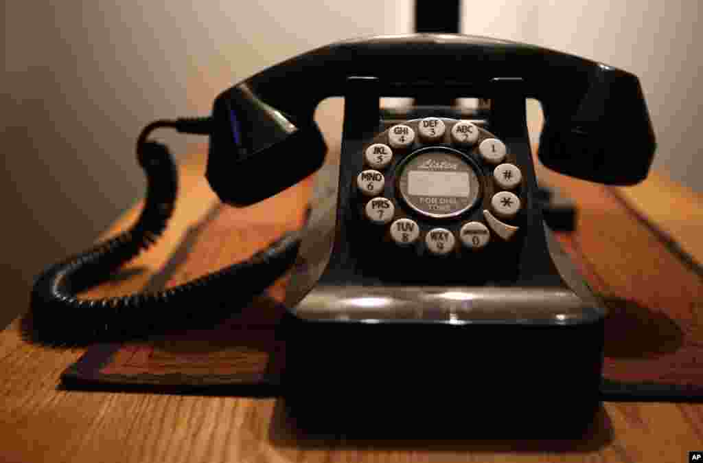 FILE - This Wednesday, April 14, 2016, file photo, shows a push-button landline telephone, in Whitefield, Maine. According to a U.S. government survey released Thursday, May 4, 2017, homes and apartments with only cellphone service exceeded 50 percent for