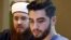 Islamic Central Council of Switzerland’s president, Nicolas Blancho, left, and multimedia chief Naim Cherni attend a news conference in Bern, Switzerland, Dec. 21, 2015. The Swiss attorney general has opened a criminal investigation of Cherni.