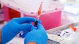 An influenza vaccine is prepared at the L.A. Care and Blue Shield of California Promise Health Plans' Community Resource Center, on October 28, 2022, in Lynwood, California. (AP Photo/Mark J. Terrill, File)