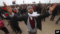 Protesters against the Libyan leader Moammar Gadhafi chant slogans during a demonstration in Benghazi, February 26, 2011