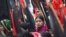 Garment workers take part in a rally against the deaths of their colleagues after a devastating fire in a garment factory in Dhaka, November 27, 2012.