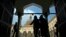 FILE - Muslims arrive to attend the Friday prayer at Al-Azhar mosque in Cairo, Egypt, Dec. 28, 2012. 