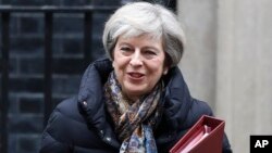 Britain's Prime Minister Theresa May leaves 10 Downing Street to attend parliament in London, Jan. 25, 2017.