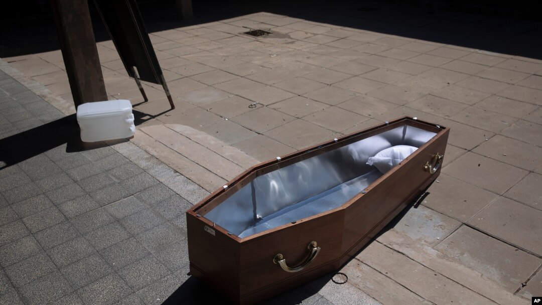 An open coffin lies on the ground at a special morgue for COVID-19 victims in the central Israeli city of Holon, near Tel Aviv, Sept. 23, 2020. 