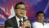 Cambodian opposition leader Sam Rainsy, left, who is currently living in exile in France, talks about the opposition's plans for next year's elections in Cambodia during the launching of the International Parliamentary Committee for Democratic Elections in Cambodia with Philippine Sen. Franklin Drilon, file photo. 