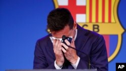 Lionel Messi cries at the start of a press conference at the Camp Nou stadium in Barcelona, Spain. FC Barcelona had previously announced the negotiations with Lionel Messi had ended and that Messi would be leaving the club.