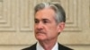 FILE - Federal Reserve Gov. Jerome Powell talks with others before a Board of Governors meeting in Washington, Nov. 30, 2015.