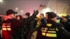 FILE - In this image taken from video, police escort Maccabi Tel Aviv fans to a metro station leading them to Ajax stadium, after pro-Palestinian fans marched near the stadium, in Amsterdam, Netherlands, Nov. 7, 2024. 