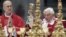 Pope Benedict XVI (R) flanked by Cardinal Tardisio Bertone conducts the holy mass of Pentecost Sunday in Saint Peter's Basilica at the Vatican, May 27, 2012. 