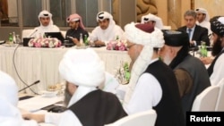 Undated handout picture of U.S., Taliban and Qatar officials during a meeting for peace talks in Doha, Qatar. Qatari Foreign Ministry/Handout via REUTERS ATTENTION EDITORS - THIS PICTURE WAS PROVIDED BY A THIRD PARTY.