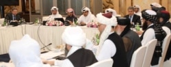 Undated handout picture of U.S., Taliban and Qatar officials during a meeting for peace talks in Doha, Qatar. (Qatari Foreign Ministry/Handout image)