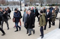 Lev Parnas, the indicted associate of U.S. President Donald Trump's personal lawyer, Rudy Giuliani, talks to his attorney, Joseph Bondy, as he walks to the U.S. Capitol after arriving in Washington, Jan. 29, 2020.