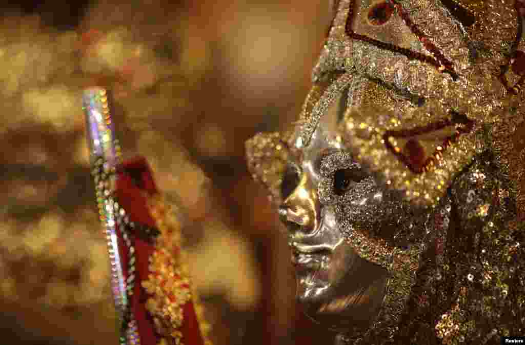 A boy dressed up as Sao Jorge, also known as Saint George, attends Sao Jorge&#39;s day celebrations in Rio de Janeiro, Brazil.