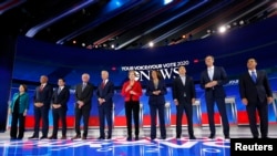 Democratic U.S. presidential candidates before the start at the 2020 Democratic U.S. presidential debate in Houston, Sept. 12, 2019. 