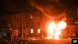 A firefighter's vehicle is ablaze after Russian drone strikes on a residential neighborhood in Kharkiv, Ukraine, on April 4, 2024.