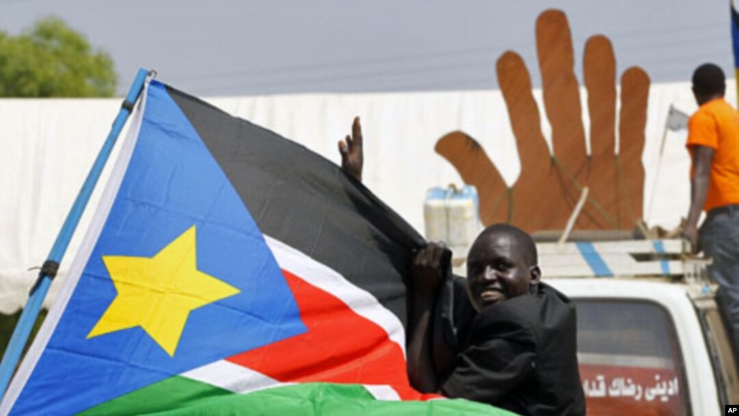 A Sudanese man cheers during a demonstration in support of the referendum on southern independence during a rally organized by the Southern Sudan Referendum Bureau in Juba, 07 Jan 2011.