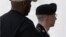 Army Pfc. Bradley Manning, right, is escorted into a courthouse in Fort Meade, Maryland, July 29, 2013, as military judge Col. Denise Lind begins her third day of deliberations in his court martial. 