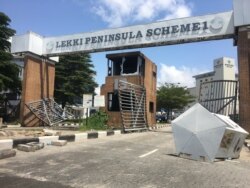 FILE - The Admiralty Way in Lekki Phase 1, a middle-class shopping area, was looted Oct. 22, 2020, after the army repressed peaceful protestors gathered at the Lekki Toll Gate despite curfew.