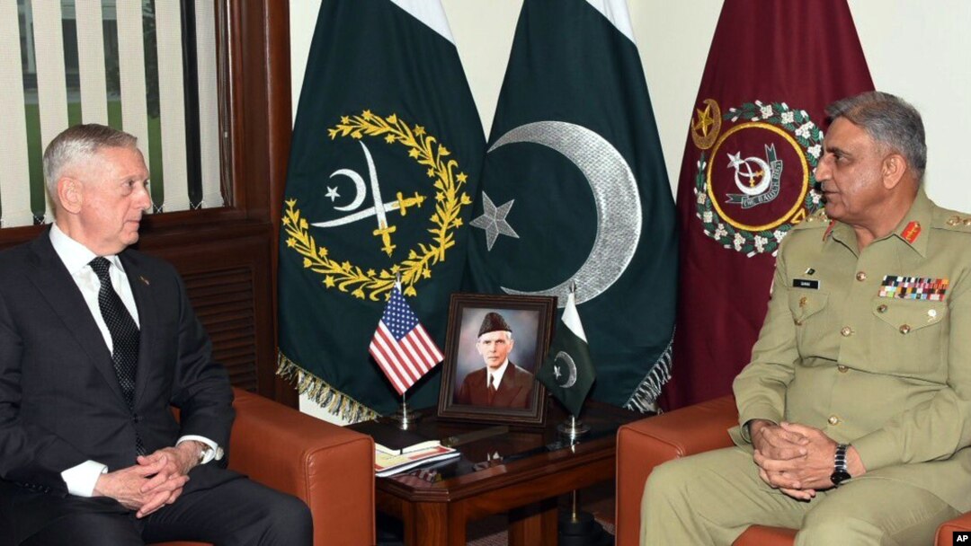 FILE - U.S. Defense Secretary James Mattis, left, meets with Pakistan's army chief Gen. Qamar Javed Bajwa in Rawalpindi, Pakistan, Dec. 4, 2017.
