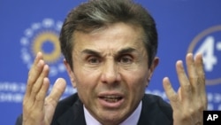 Georgia's billionaire and opposition leader Bidzina Ivanishvili speak to the media during press conference in Tbilisi, October 2, 2012. 