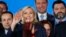 FILE - French far right leader Marine Le Pen, center, waves on stage next to other populist leaders at the end of a May Day meeting in Nice, south of France, May 1, 2018.