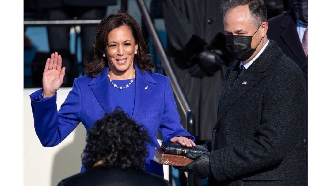 Kamala Harris is sworn in as Vice President as her spouse Doug Emhoff holds a bible during the 59th Presidential Inauguration at in Washington, Jan. 20, 2021.