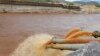 FILE - Water gushes out from pipes by the construction of Ethiopia's Great Renaissance Dam in Guba Woreda, some 40 kilometers from Ethiopia's border with Sudan.