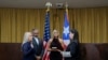 Justice Secretary Wanda Vazquez is sworn in as governor of Puerto Rico by Supreme Court Justice Maite Oronoz, in San Juan, Aug. 7, 2019. Vazquez was joined by her daughter Beatriz Diaz Vazquez and her husband Judge Jorge Diaz. 