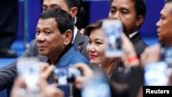 Philippine President Rodrigo Duterte arrives at an event with Filipino community in Hong Kong, April 12, 2018.