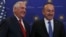 U.S. Secretary of State Rex Tillerson, left, and Turkey's Foreign Minister Mevlut Cavusoglu stop for photographers prior to their meeting in Ankara, March 30, 2017.