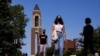 FILE - Masked students walk through the campus of Ball State University in Muncie, Ind., Sept. 10, 2020.