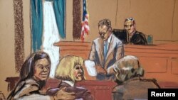 FILE- E. Jean Carroll reacts, next to her attorneys Shawn Crowley and Roberta Kaplan, as the verdict is read in the civil rape accusation case against former U.S. President Donald Trump,, in New York, U.S., May 9, 2023 in this courtroom sketch.