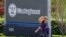 FILE - A woman walks past the sign marking the entrance to the Westinghouse International Headquarters on May 19, 2014, in Cranberry, Pa.
