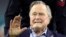 FILE - Former U.S. President George H.W. Bush arrives on the field to do the coin toss ahead of the start of Super Bowl LI between the New England Patriots and the Atlanta Falcons in Houston, Texas, Feb. 5, 2017. 