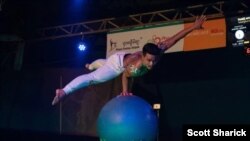 Circus artists in Cambodia attempt to break the Guinness World Record for the longest performance. (Photo by Scott Sharick)