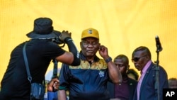 FILE — South African President Cyril Ramaphosa greets African National Congress supporters at the Siyanqoba rally at FNB stadium in Johannesburg, South Africa, Saturday, May 25, 2024. 