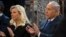 FILE - Israeli Prime Minister Benjamin Netanyahu, right, and his wife Sara Netanyahu applaud during their visit to a synagogue in Vilnius, Lithuania, Aug. 26, 2018.
