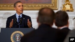 President Barack Obama speaks to members of the National Governors Association in the State Dining Room of the White House in Washington, Feb. 24, 2014.