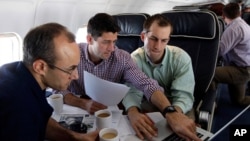 Republican vice presidential candidate, Rep. Paul Ryan, center, R-Wis., works on the speech he will deliver at the Republican National Convention, Aug. 28, 2012.
