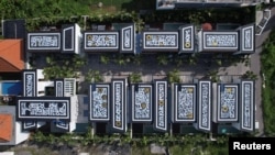 View from above of Russian Pokras Lampas' calligraphy artworks on the tops of Ukrainian Alex Shtefan's getaway homes in Bali, Indonesia on March 5, 2022. (Dmitry Moiseev/Handout via REUTERS)