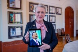 Chair of the Nobel Committee Berit Reiss-Andersen holds a picture of Ethiopia's Prime Minister Abiy Ahmed, whom she previously announced as the Nobel Peace Prize Laureate for 2019, in Oslo, Norway, Oct. 11, 2019.