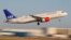 FILE - A Scandanavian Airlines, known as SAS, Airbus A320-200 airplane takes off from the airport in Palma de Mallorca, Spain.