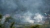 FILE-Remnants of the previous crop are burning in a village near Dharamshala, India, Monday, June 5, 2023. (AP Photo/Ashwini Bhatia)