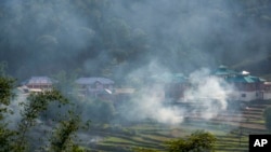 FILE-Remnants of the previous crop are burning in a village near Dharamshala, India, Monday, June 5, 2023. (AP Photo/Ashwini Bhatia)