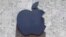 FILE - The Apple logo is seen at a store in Miami Beach, Florida, Aug. 8, 2017. 