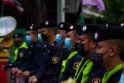 Police stand in line blocking road access during anti-government protests in Bangkok, Thailand, June 26, 2021. (Tommy Walker/VOA)